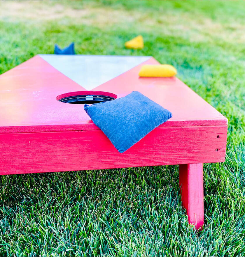 Cornhole boards set up for a backyard game