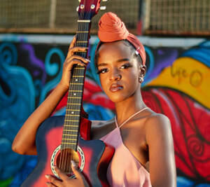 Musician with colorful backdrop
